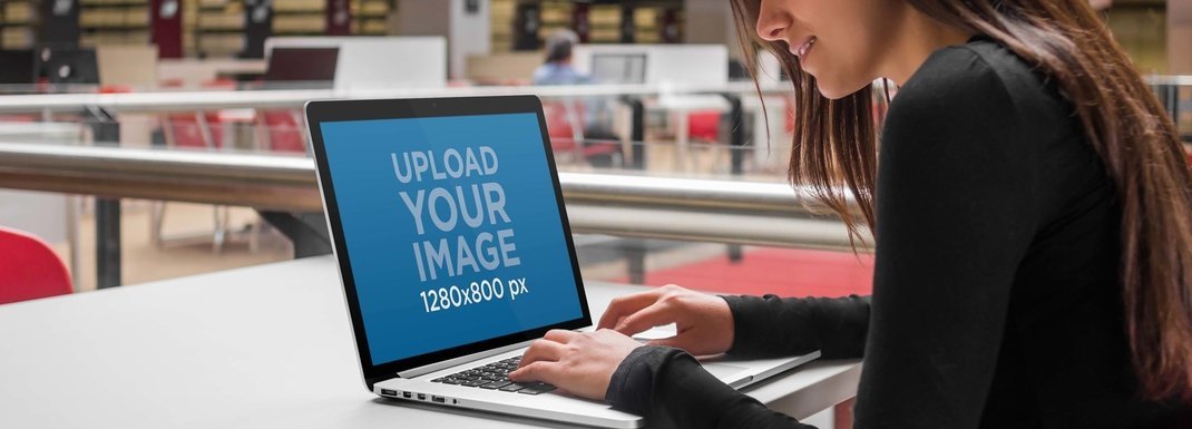 Laptop Mockup of a Woman Using her Macbook at the Cafeteria