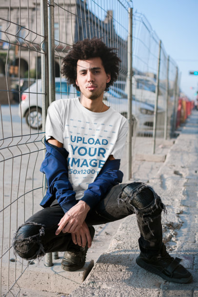 Mockup Featuring a Curly Haired Man with an Attitude Wearing A Tee