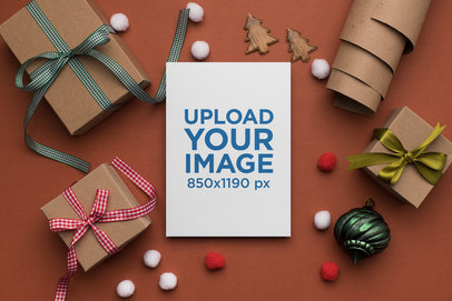 Mockup of a Beautiful Christmas Greeting Card Surrounded by Gifts
