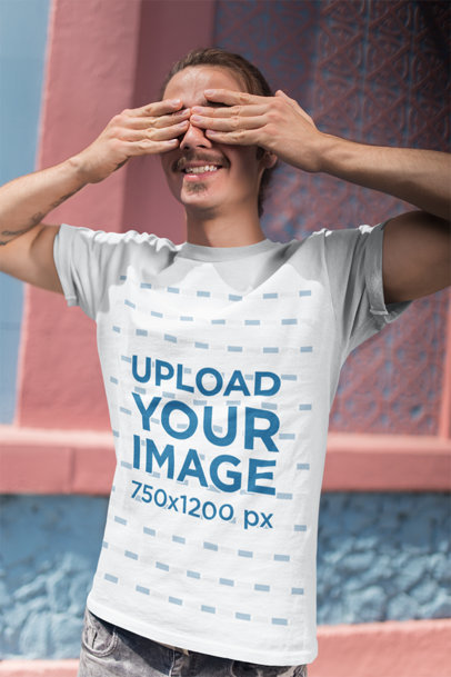 T-Shirt Mockup Featuring a Man Covering His Eyes in a Playful Manner 20149