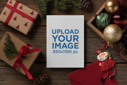 Christmas Holiday Greeting Card Mockup with Gift Boxes and Santa Ornament