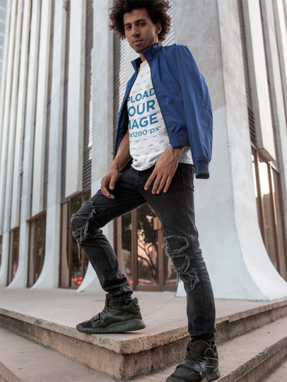 T-Shirt Mockup Featuring a Serious Man Looking at the Camera Wearing Ripped Jeans 18074