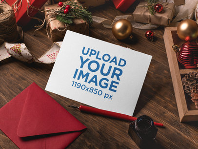 Mockup of an Xmas Greeting Card Surrounded by Christmas Decorations