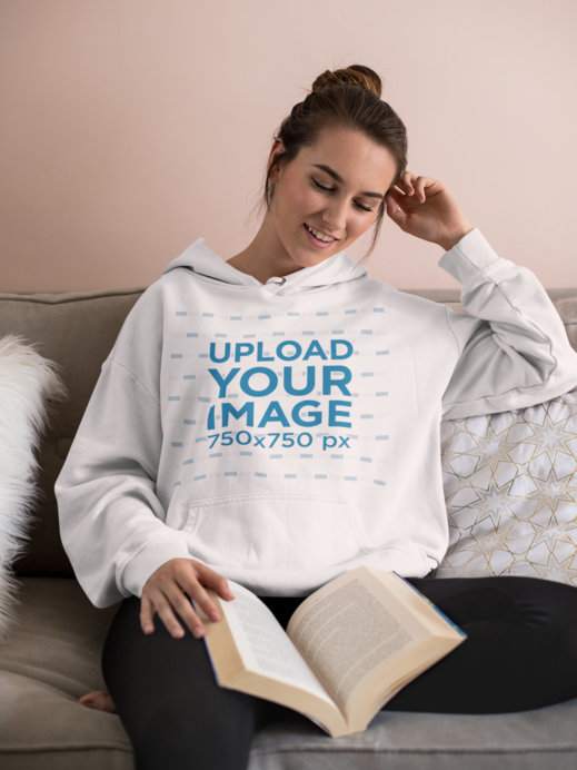Mockup of a Laid-Back Woman Reading on a Couch