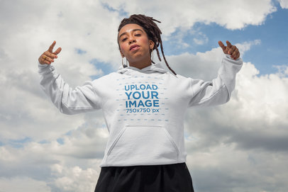 Mockup of a Woman with Locks Wearing a Hoodie With the Sky Behind Her 23416