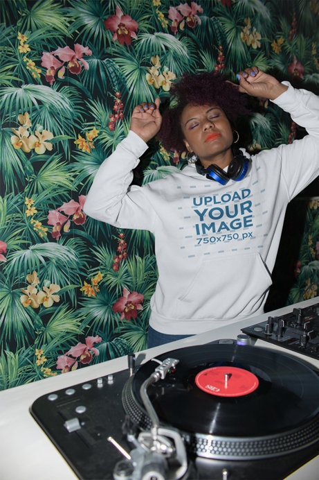 Hoodie Mockup of a Cool DJ Mixing Some Tracks