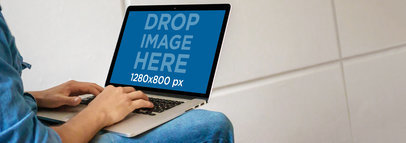 Macbook Mockup of a Young Man Typing on His Laptop a4639