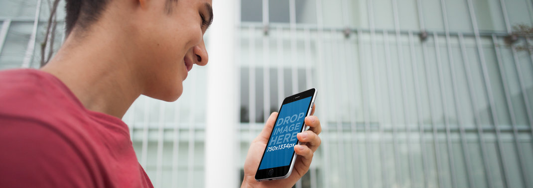 iPhone 6 Mockup Template of a Young Man Walking