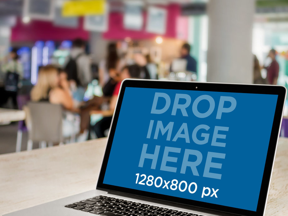 Macbook Mockup Template at a Crowded Cafeteria