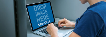 Macbook Mockup of a Man Working From His Cubicle a4643