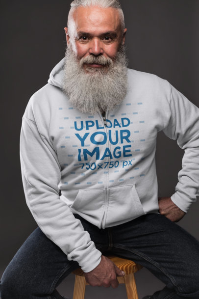 Full Zip Hoodie Mockup Featuring a Senior Male Model Posing in Studio