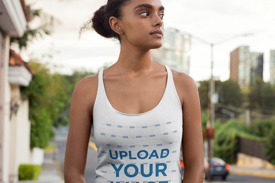 Racerback Tank Top Mockup of a Woman Looking to Her Left on the Street
