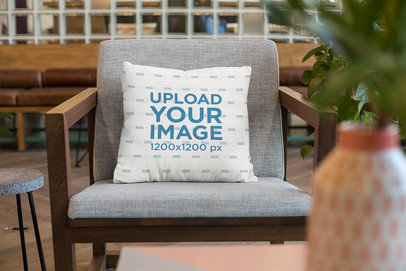 Square Pillow Mockup on an Armchair at a Lounge