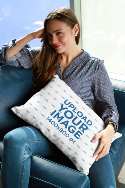 Pillow Mockup of a Smiling Woman Sitting on the Couch