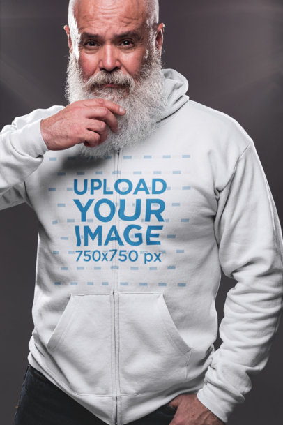 Full Zip Hoodie Mockup of a Senior Man with a Beard Looking into the Camera 