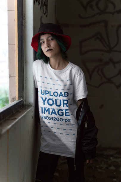 Mockup of a Goth Woman Wearing a T-Shirt Inside a Dark Room