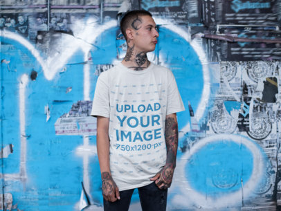 Mockup of a Gothic Man with Neck Tattoos Wearing a Loose Tee  