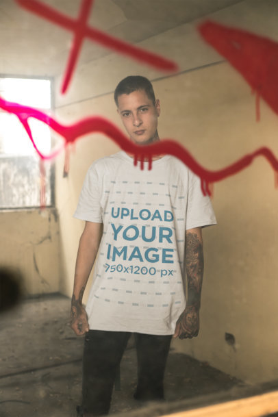 T-Shirt Mockup of a Punk Man with Tattoos Surrounded by Graffiti