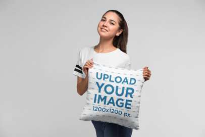 Pillow Mockup of a Woman at a Studio
