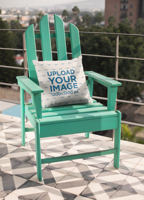 Mockup of a Pillow Lying On a Rustic Blue Chair
