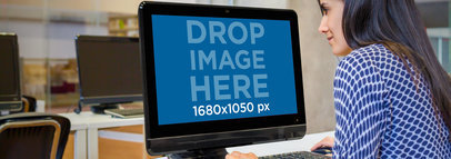 Mockup of a Young Woman Using a PC in a Computer Classroom