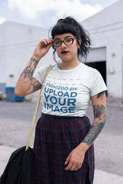 Round Neck Tee Mockup of a Tattooed Goth Woman at an Industrial Area