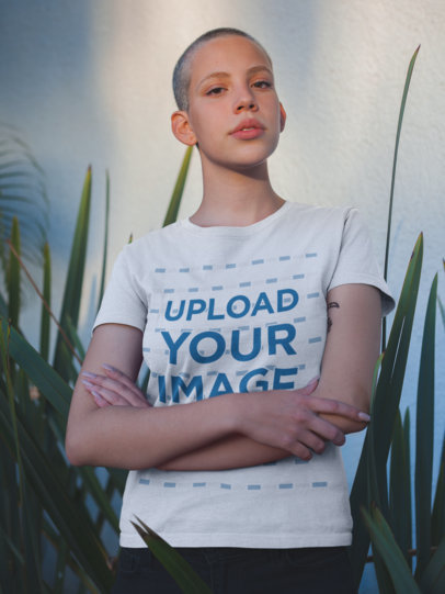 Tee Mockup of an Alternative Woman with a Buzz Cut Haircut Crossing Her Arms