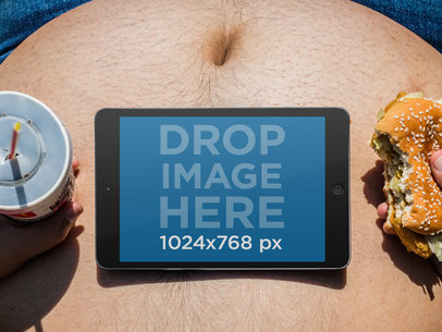 Fat Guy Eating a Burger While Watching a Movie on his iPad Mockup