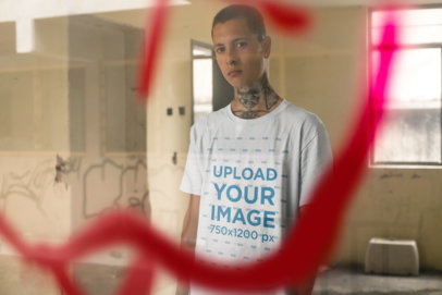 Tee Mockup of a Punk Man With Tattoos Behind a Graffiti on a Window 23460
