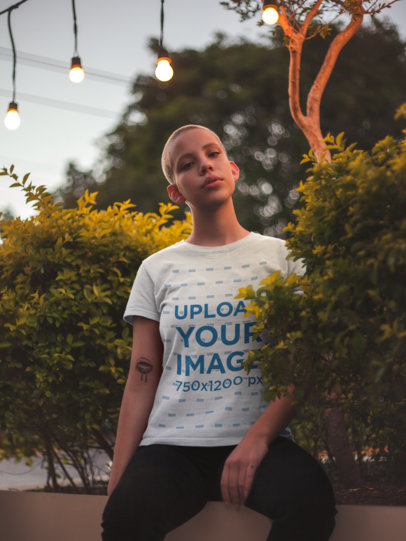Mockup of a Buzz Cut Woman Wearing a T-Shirt at Dusk