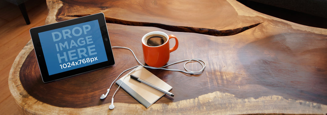 Tablet Mockup Featuring an iPad on top of a Wooden Coffee Table