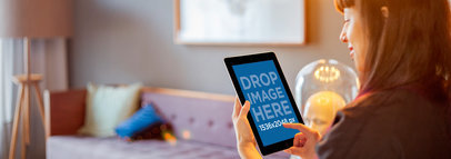 Tablet Mockup of a Young Lady Using an iPad at Home 4919