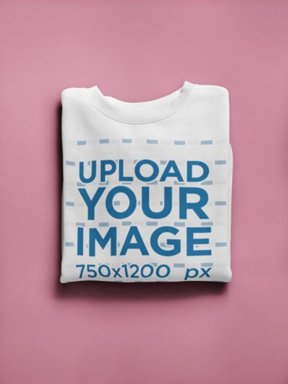 Mockup of a Folded Sweatshirt on a Solid Surface