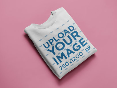 Flat Lay Crewneck Sweater Mockup on a Solid Color Surface