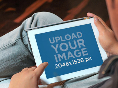 Mockup of a White iPad Featuring a Man at Home