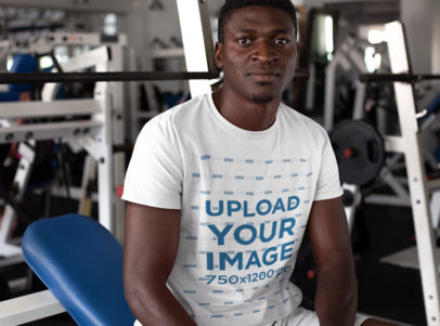 T-Shirt Mockup of a Man Resting Between Sets at the Gym