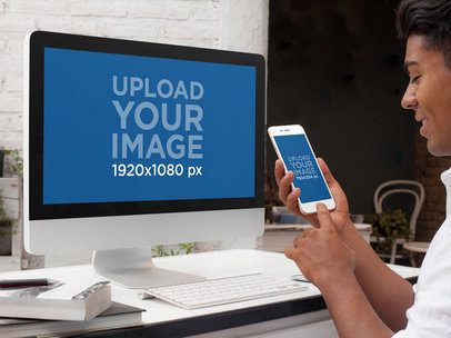 Mockup of a Young Designer Working on an iMac and Using an iPhone