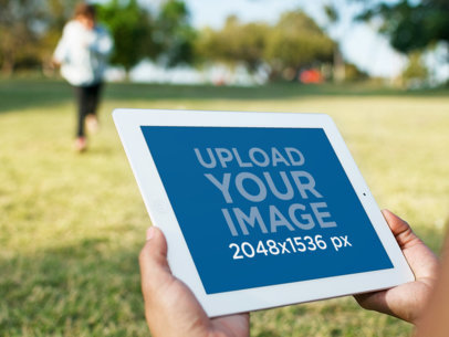 Running at the Park With White iPad