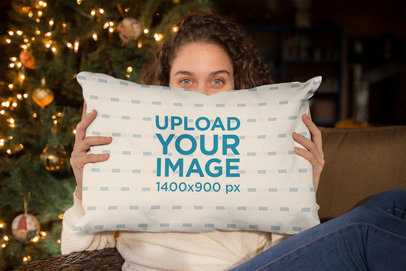 Pillow Mockup of a Beautiful Woman Holding a Pillow with a Christmas Background