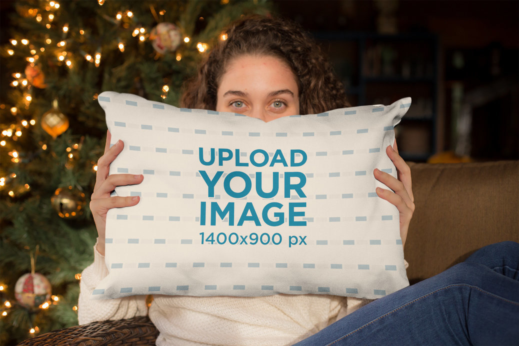 Pillow Mockup of a Beautiful Woman Holding a Pillow with a Christmas Background