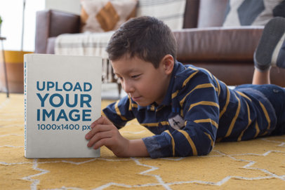 Back to School Mockup of a Young Boy Lying on His Chest Reading a Book