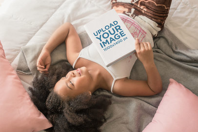 Book Mockup of a Cute Little Girl Lying on Her Bed Dreamily