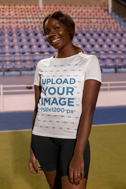 Mockup of a Happy Woman Wearing a Sports Jersey in a Stadium