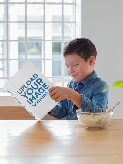 Mockup of a Happy Young Boy Reading His Book at a Table 23715