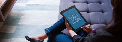 iPad Mockup of a Woman Sitting on a Couch Using an iPad
