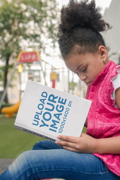 Back to School Book Mockup of a Little Girl Reading near the Playground