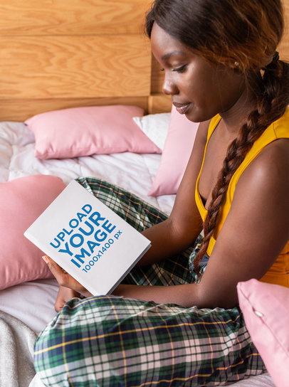 Mockup of a Woman Holding a Hard Cover Book 23711