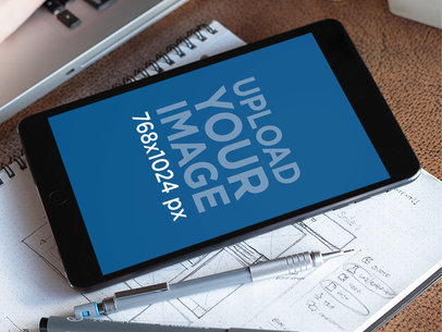 Black iPad Mini On Notebook