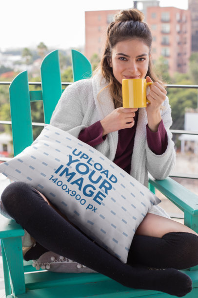 Pillow Mockup of a Gorgeous Girl Sipping a Cup of Hot Cocoa 23573