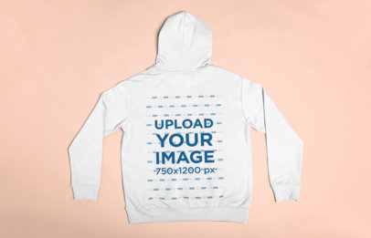 Flat Lay Mockup of the Back of a Pullover Hoodie Lying on a Surface